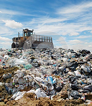 The bulldozer on a garbage dump