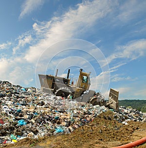 The bulldozer on a garbage dump