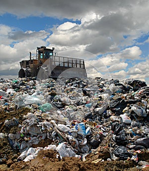 The bulldozer on a garbage dump