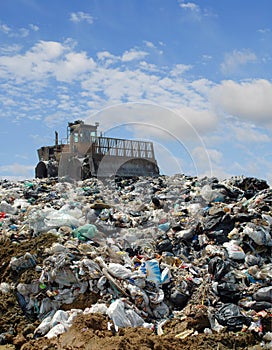 The bulldozer on a garbage dump