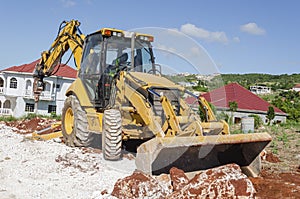 Bulldozer With Jackhammer Working Across Trench