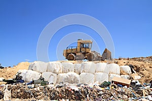 Bulldozer in landfill