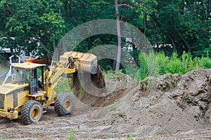 Bulldozer landscaping works on construction working with earth while doing