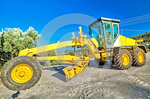 Bulldozer laying asphalt concrete