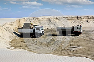 Bulldozer loading truck