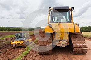 Bulldozer machine during construction road works