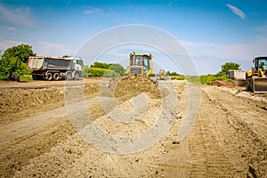 Bulldozer machine is leveling construction site