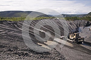Bulldozer in the mountains of Eastern Siberia / Earthworks / Mining