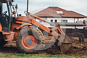 Bulldozer moving earth and doing landscaping works