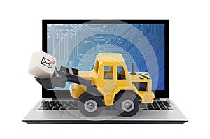 Bulldozer with new email graphic on computer key on laptop