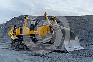 Bulldozer on a parking lot in winter time.