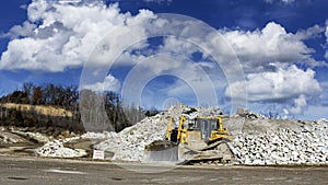 Bulldozer in a quarry landscape