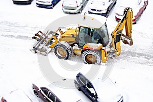 Bulldozer shoveling the snow