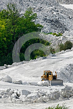Bulldozer on White Road of Marble Mine