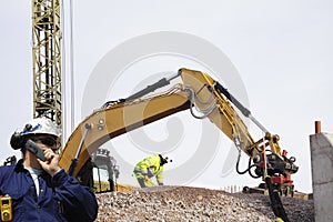 Bulldozer and workers in action