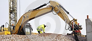 Bulldozer and workers in action photo