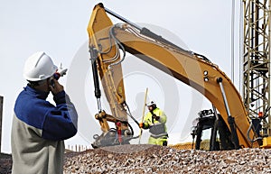 Bulldozer and workers in action photo