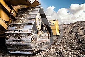 Bulldozer Working on Dirt on the Construction Site