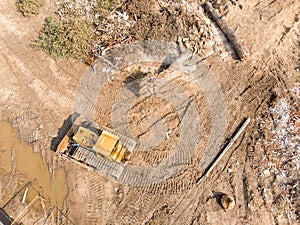 Bulldozer working at old building demolition site