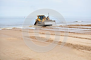 Bulldozer working at seashore