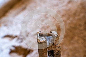 Bullet After Being Shot on The Snowy Sand Background - With Ballistic Marks