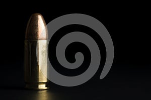 Bullet on black photo