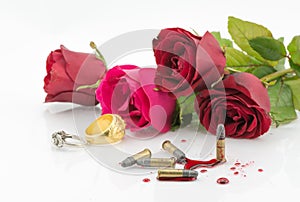 Bullet on blood and red rose on white background