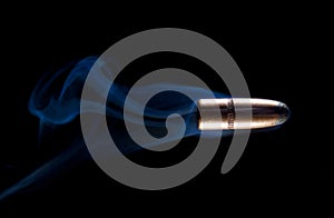 Bullet and blue smoke