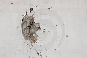 Bullet hole on building wall in Sarajevo