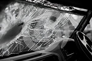 Bullet hole on a car windshield. Car window after a raid has a bullet hole. Broken glass. Bullet holes in a front windshield.