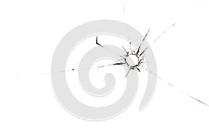 Bullet hole in glass close up on white background