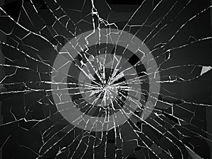 Bullet hole and pieces of shattered or smashed glass photo