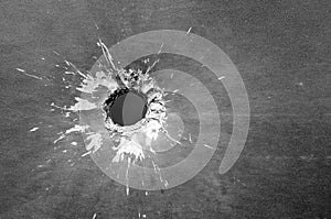 The bullet hole shot black and white