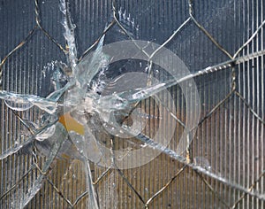 Bullet Hole in Wire Mesh Glass with Ridges