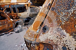 Bullet holes in burned car shell in Ukraine