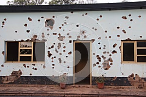 Bullet holes left in the Camp Kigali building where Belgian soldiers were killed in 1994 photo