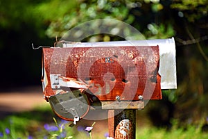 Bullet Holes in Rusty Rural Mailbox