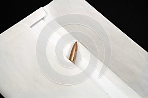 Bullet inside envelope