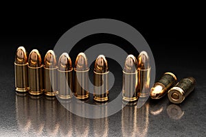 Bullet isolated on black back with reflexion. Rifle bullets close-up on black back. Cartridges for rifle and carbine on a black