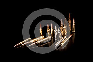 Bullet isolated on black background with reflexion. Rifle bullets close-up on black back. Cartridges for rifle and carbine on a