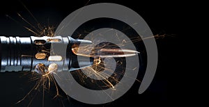 Bullet with sparks and smoke leaving the barrel of an AR-15 photo