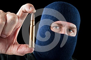 Bullet and terrorist photo