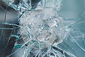 Firearms bullethole on bulletproof glass, cracks background photo