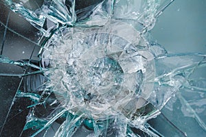 Bulletproof glass background, bullethole from the bullets, cracks photo