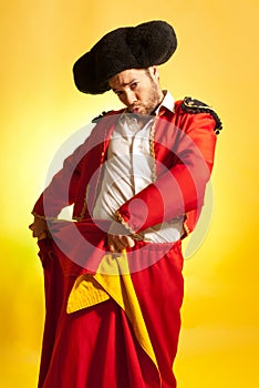 Bullfighter courage red yellow humor spanish color photo