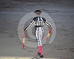 Bullfight in spain with Big black bull in the spanish bullring