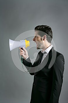 Bullhorn businessman megaphone profile shouting