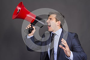 Bullhorn businessman megaphone profile shouting