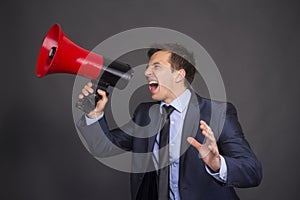 Bullhorn businessman megaphone profile shouting