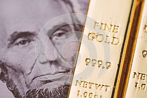 Bullion, gold or ingot on US dollar banknote using as wealth, investment and safe haven on financial crisis